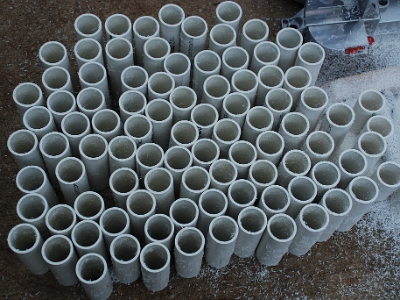 Cutting LC31 coupler coil forms.  This is a batch of raw coil forms for type LC31 couplers.  They will be cleaned and then undergo the further manufacturing steps before being turned into finished LC31 couplers.