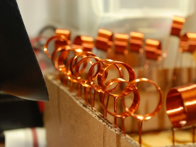 Type L4 tank inductors for SPA5 amplifiers drying after being dip coated.  These L4 inductors have been dip coated and are waiting to dry before the next manufacturing step.